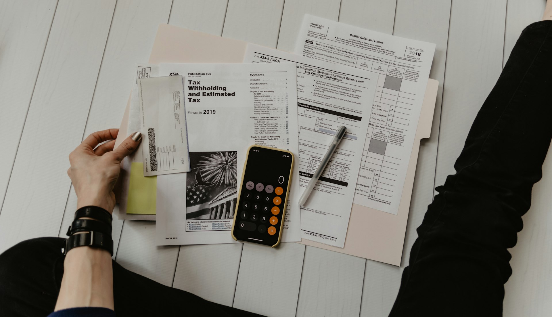 Tax documents and a calculator, representing tax solutions.